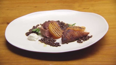 Pan fried duck breast with black lentils and charred peaches