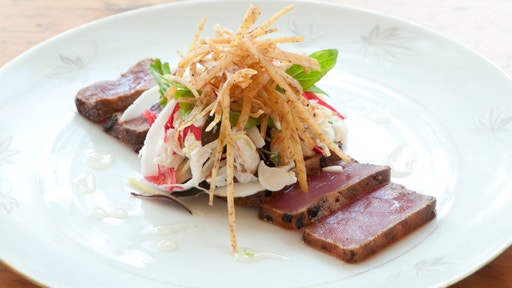 Rare Seared Green Ant and Green Chilli Crusted Tuna Fragrant Palm Heart and Swimmer Crab Salad Young Coconut and Lime Sauce
