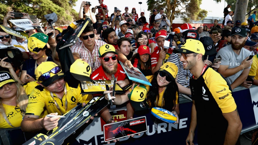 Daniel Ricciardo of Australia and Renault Sport F1 arrives at the circuit and greets fans