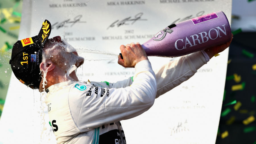 Race winner Valtteri Bottas of Finland and Mercedes GP celebrates on the podium
