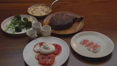 Rib Eye on the Bone, Potato Gratin, Citrus Scampi, Grilled Broccolini and Tomato Salad