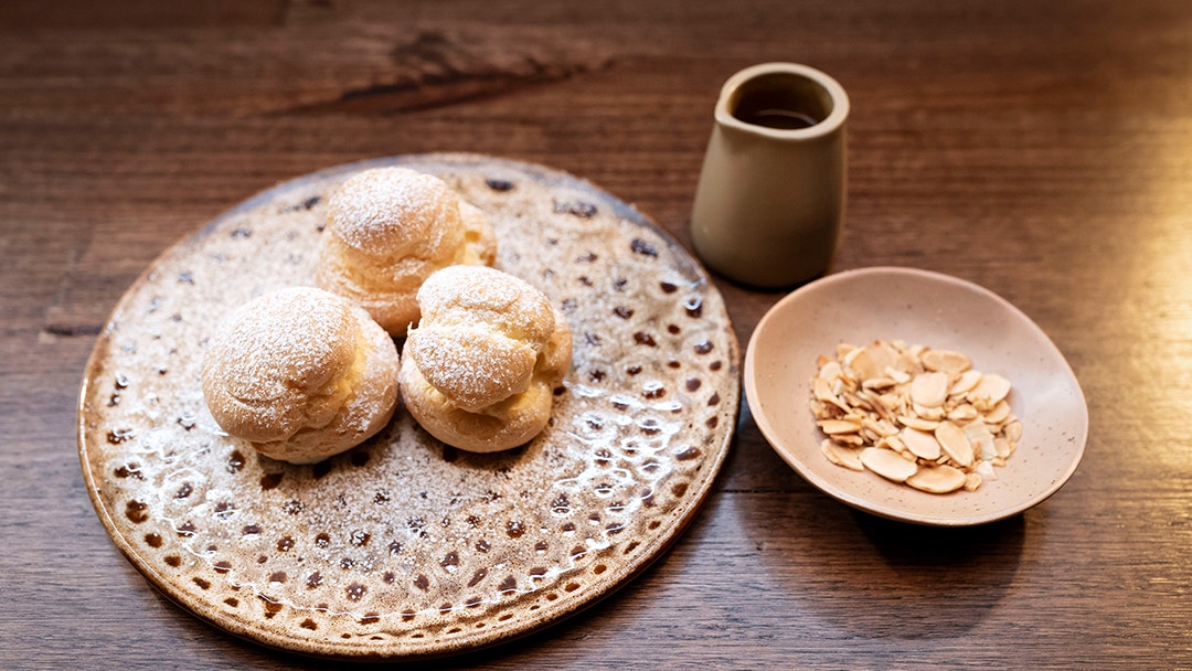 Vanilla Almond Profiterole with Butterscotch Sauce and Toasted Almonds