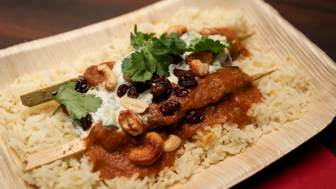 Tandoori Beef Skewers, Biryani Rice with a Spicy Curry Sauce and Raita