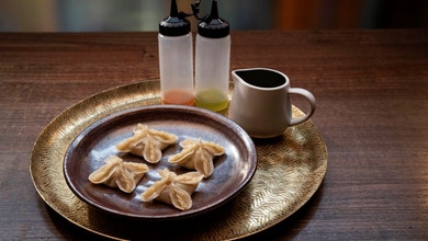 Smoked Quail Dumplings with a Prawn and Caramelised Apple Skin Sauce
