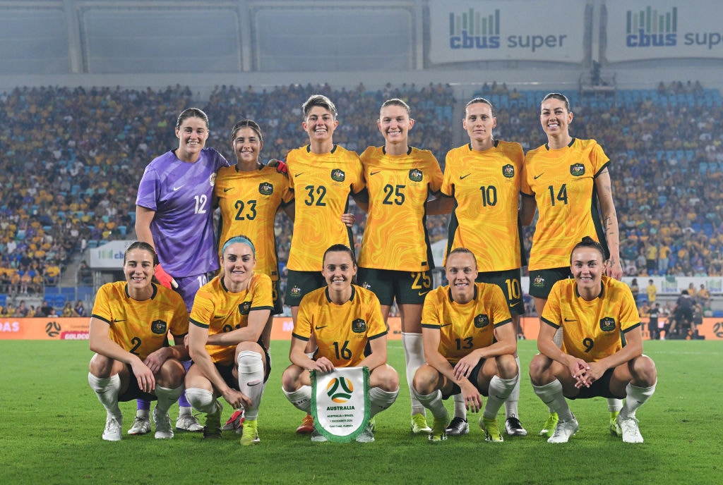 GOLD COAST, AUSTRALIA - DECEMBER 01: Australia players line up for a team photo prior to the International Friendly match between the Matildas and Brazil at Cbus Super Stadium on December 01, 2024 in Gold Coast, Australia. (Photo by Bradley Kanaris/Getty Images)