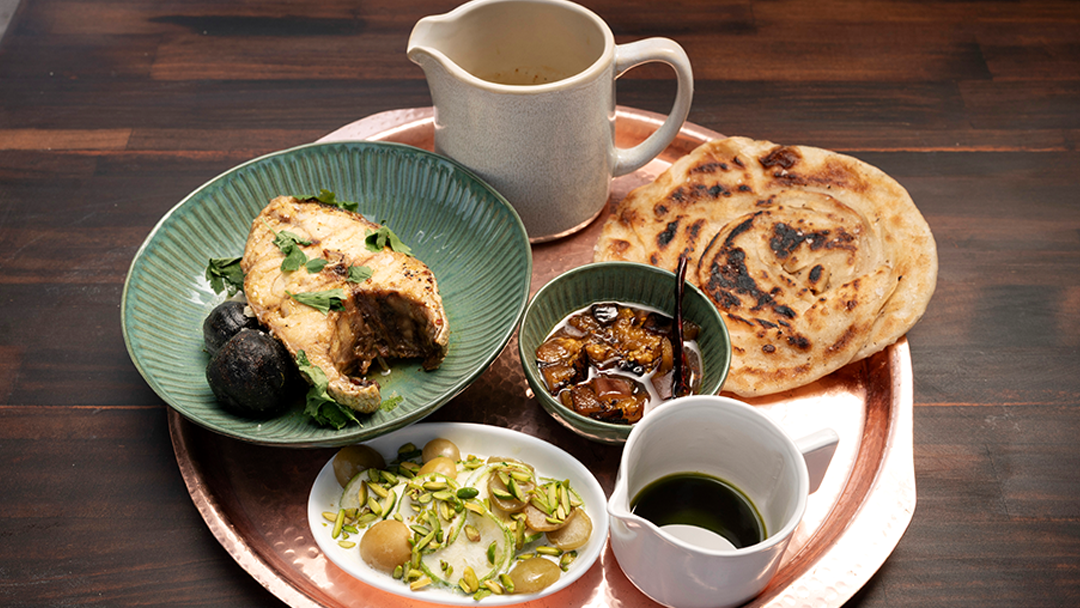 Poached Harmour with Black Lime Sauce, Achar, Zucchini Kefir Laban Salad and Flatbread