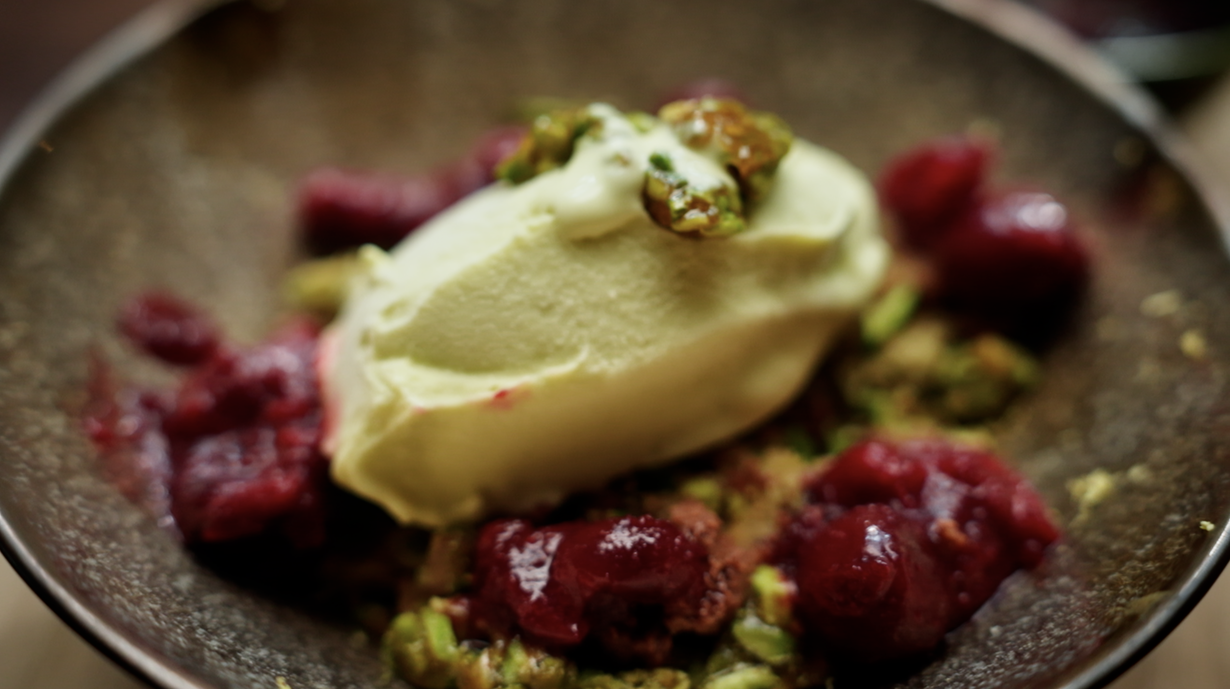 Sour Cream & Avocado Ice Cream With Pistachio Crumb, Burnt White Chocolate & Sour Cherry Coulis