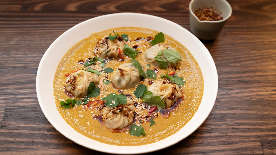 Chicken Momos With Tomato Chutney & Chilli Oil